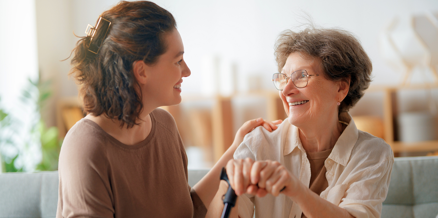 An elderly couple sitting together happily at home in Alabama